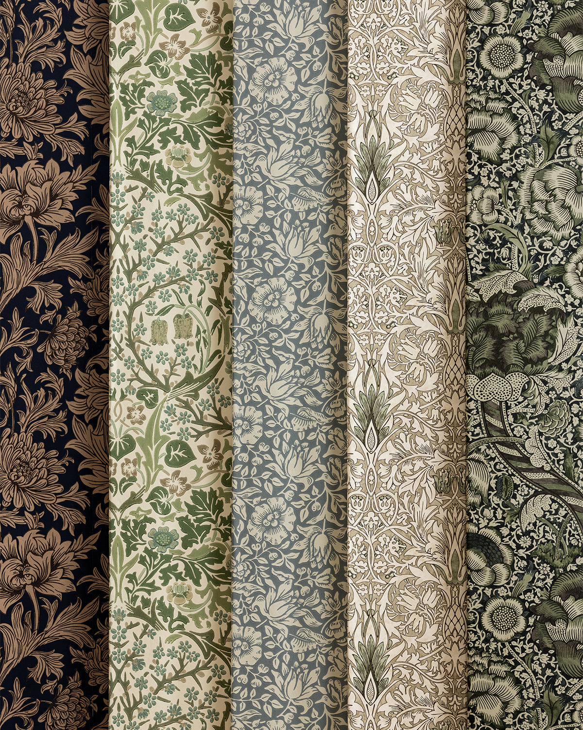 Certainly! Here’s the sentence with the exact string McGee & Co. blended at the end: Five rolls of Sanderson Design Group’s Morris & Co. x McGee & Co. Blackthorn Wallpaper stand upright, side by side, showcasing intricate floral and botanical designs in earthy hues like navy, green, beige, blue, and dark brown—McGee & Co.