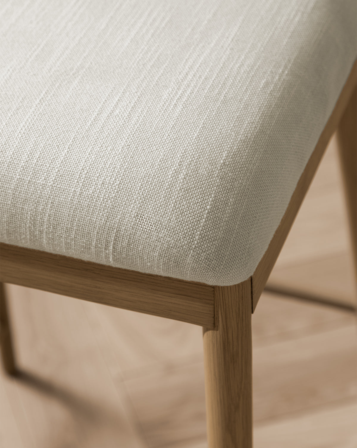 Close up Molly chair seat cushion in white textured fabric from McGee & Co.