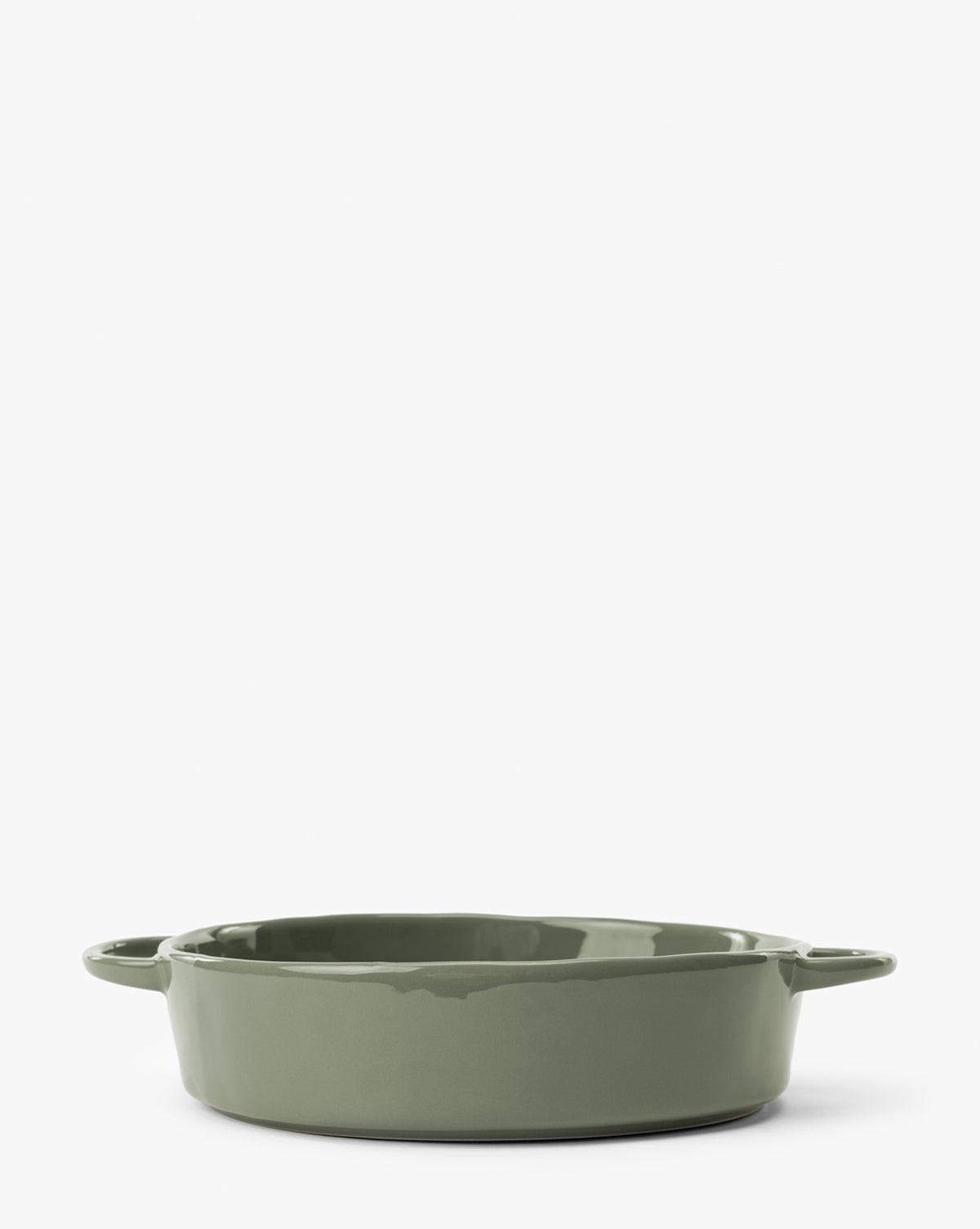 A green 2 Quart Stoneware Baker (Set of 2) with two small handles is shown against a plain white background. The round dish has a glossy finish, by McGee & Co.