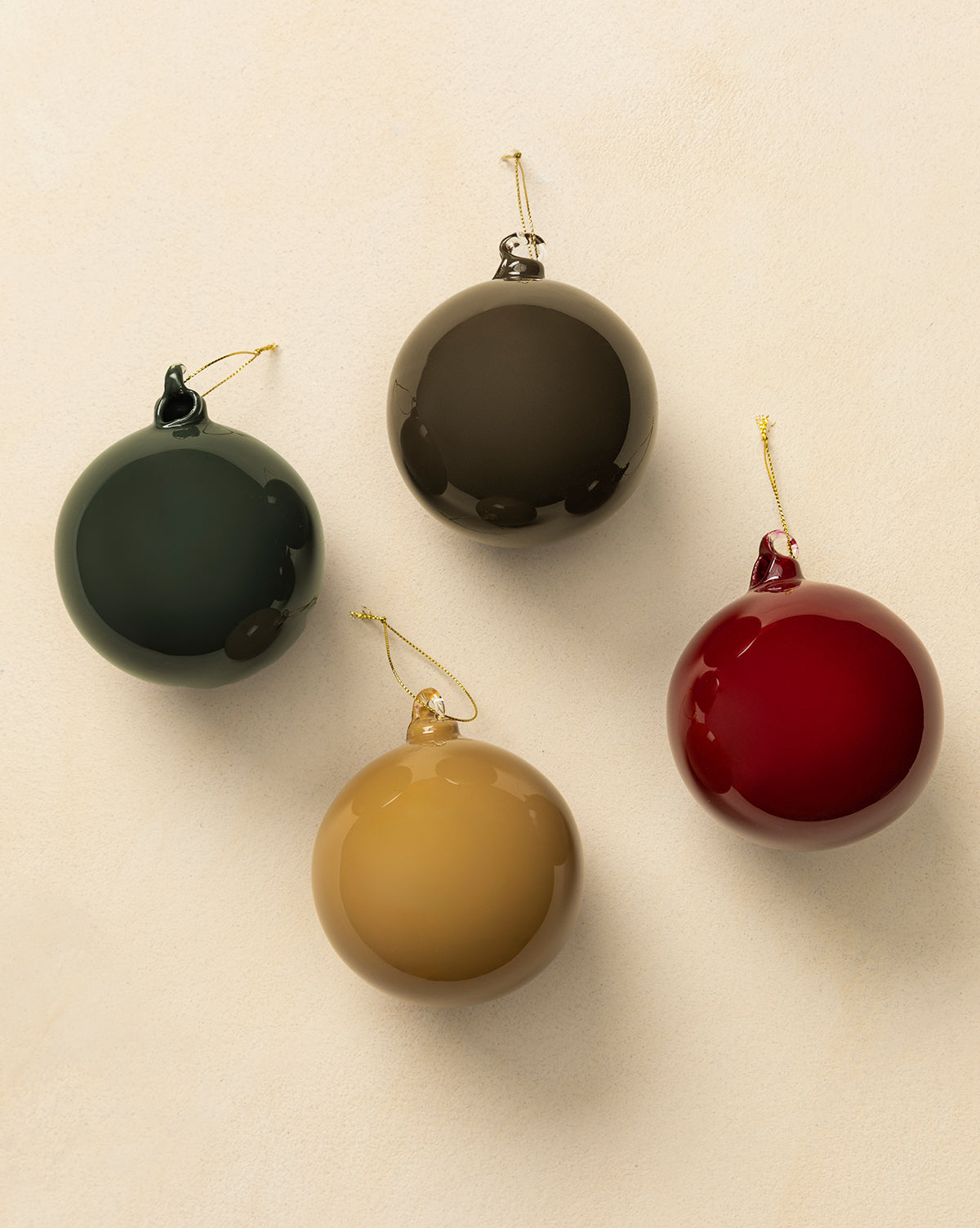 Each glass bauble has a gold hanging string—perfect for holiday decorating, by McGee & Co.