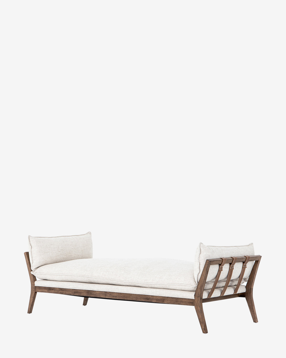 The Aberdeen Day Bed boasts a modern parawood frame, light beige cushions, and two bolster pillows with taupe leather buckles, all presented on a plain white background, by McGee & Co.