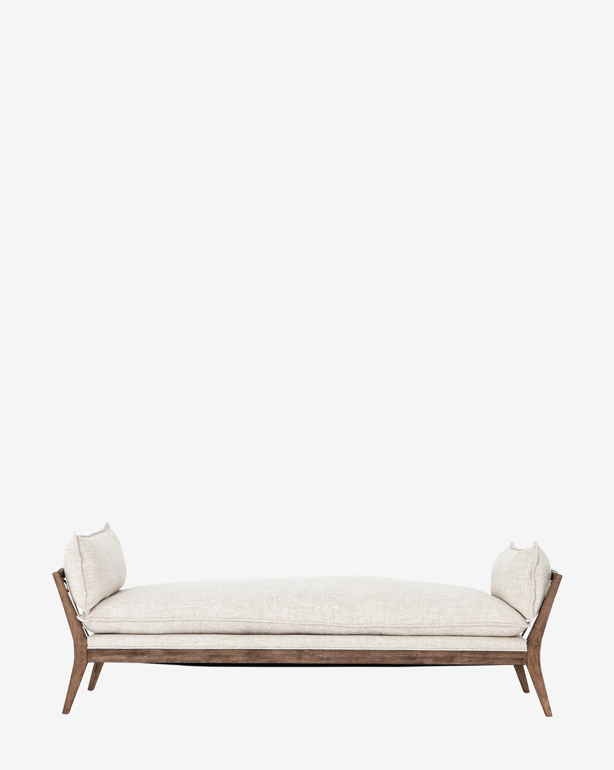 The Aberdeen Day Bed by Four Hands features a modern beige upholstered design with a sturdy parawood frame, wooden legs, and two matching side cushions, resembling a compact chaise, shown against a plain white background. McGee & Co.