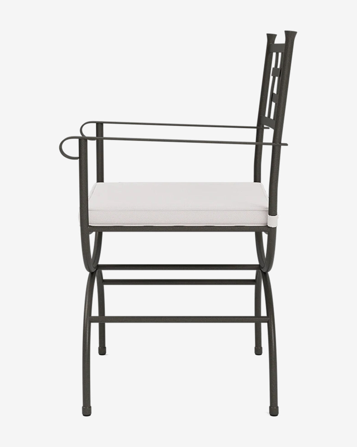The Addie Outdoor Chair features a black metal frame, straight armrests, a footrest, and a square white performance fabric cushion, by McGee & Co. Its minimalist and modern design makes it ideal for patio dining.