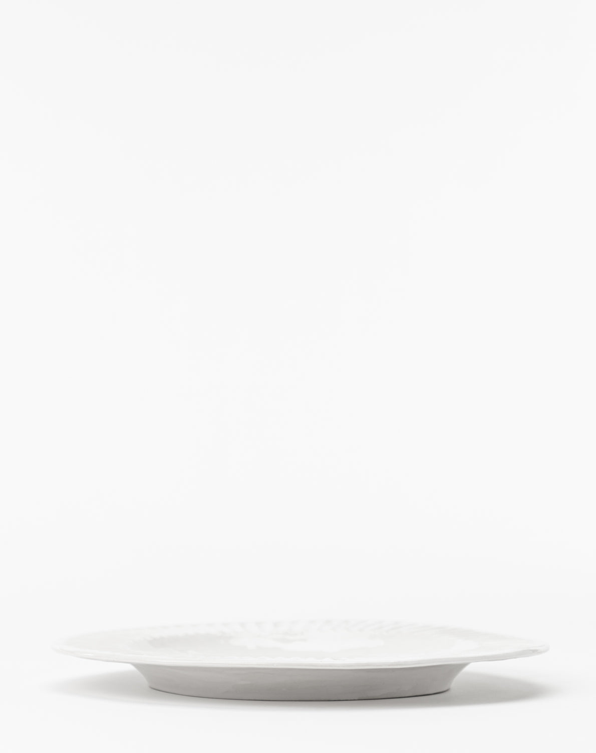 The Adele White Dinner Plate (Set of 4) features a timeless, elegant design with a shallow profile, by McGee & Co.