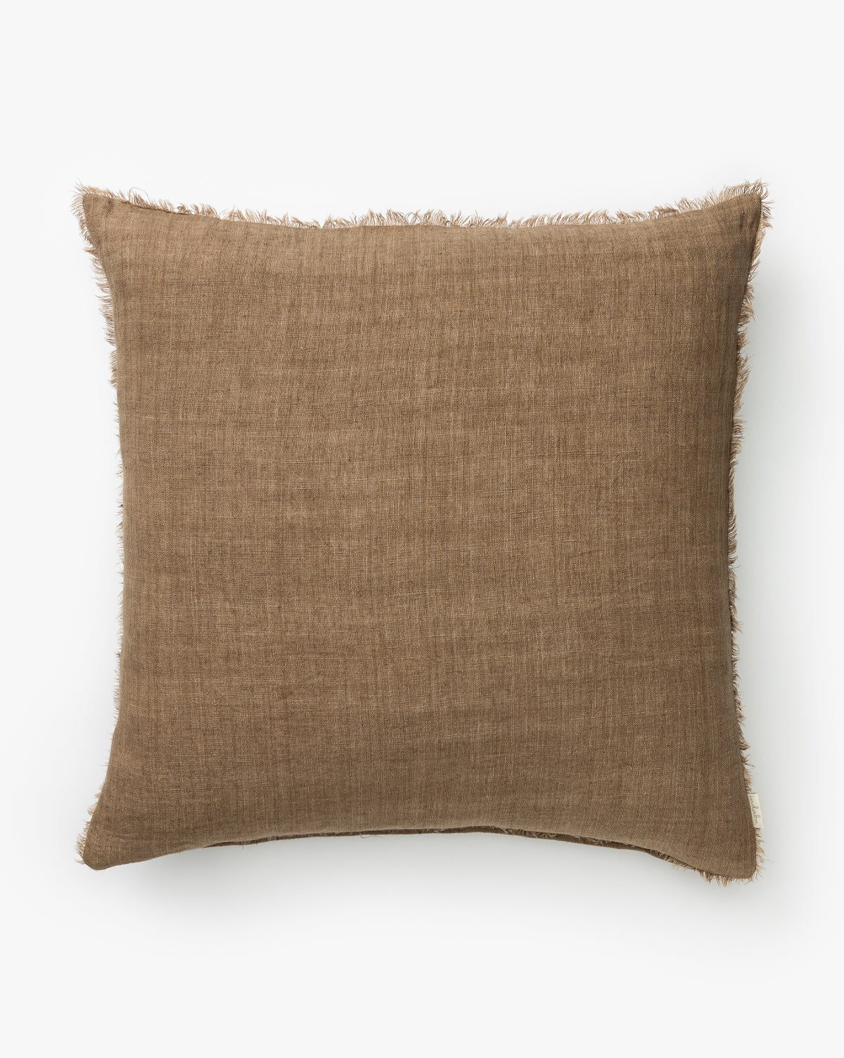The Adriana Pillow Cover features textured brown fabric with frayed edges, bringing warmth and style to any room, by McGee & Co. Shown on a plain white background.
