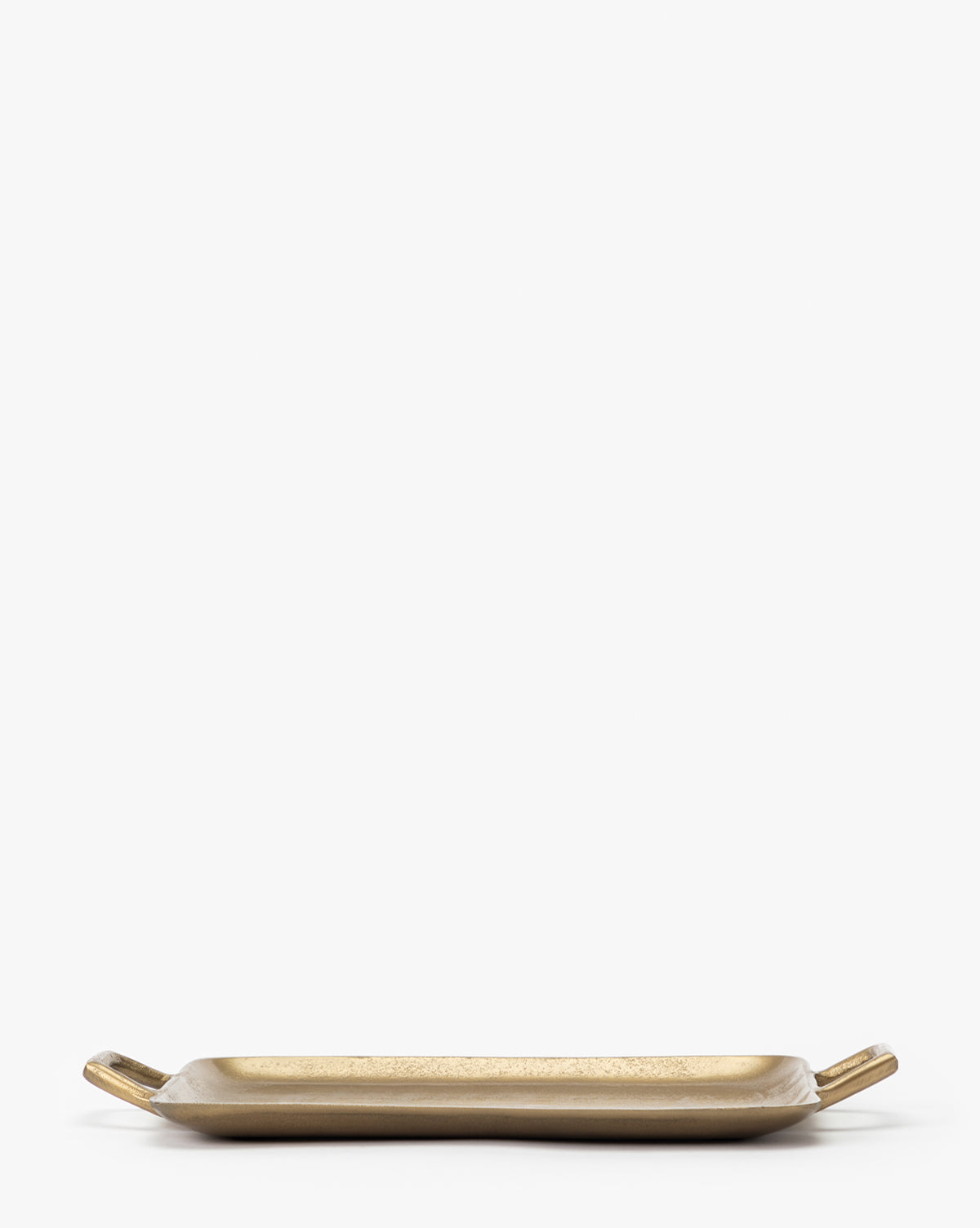 The Adrienne Brass Tray is a rectangular decorative piece featuring small upward-curved handles at each end, shown against a plain white background.