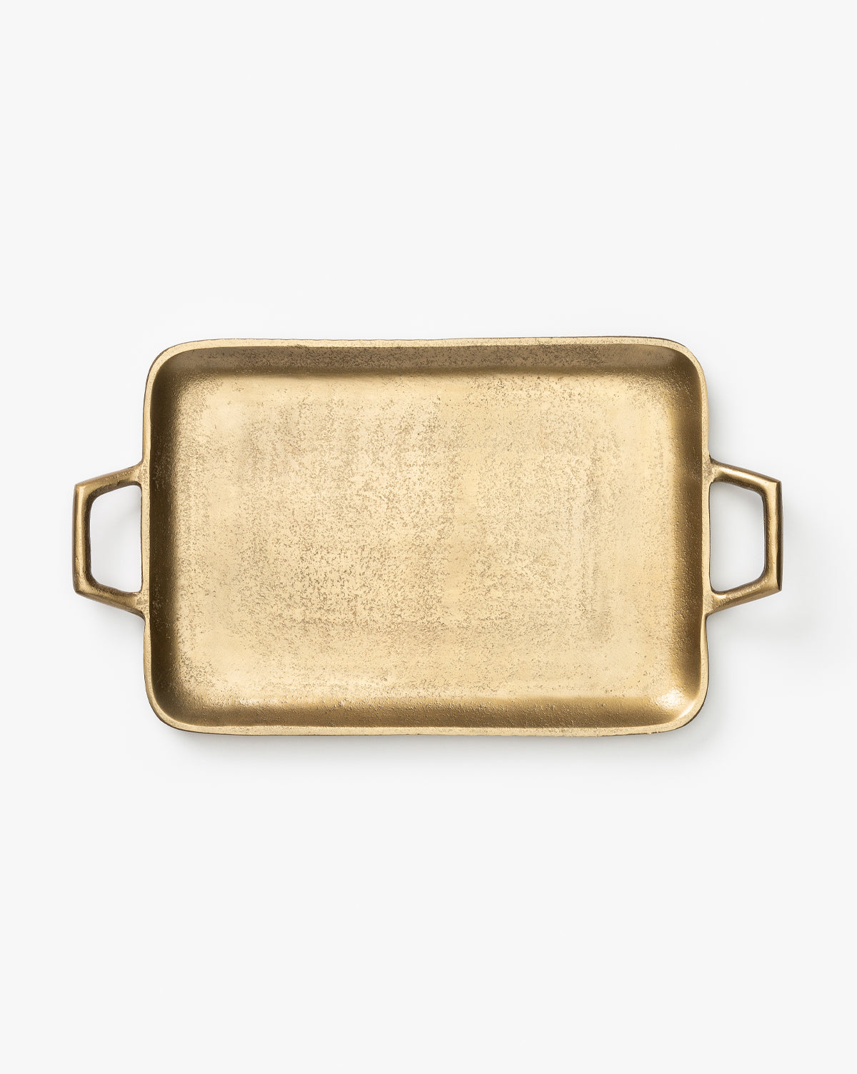 The Adrienne Brass Tray, a rectangular decorative tray with two handles, is shown photographed from above on a white background.