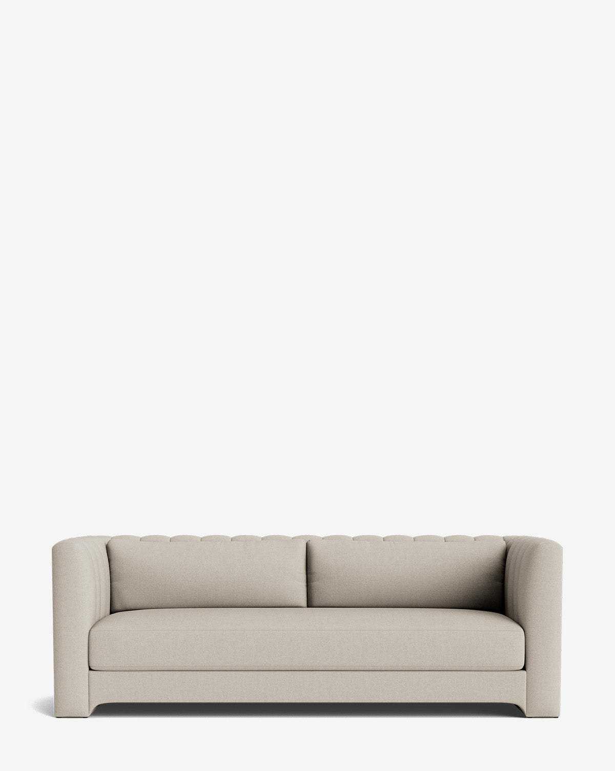 The Agatha Sofa 90 is a modern, light beige upholstered piece with rounded arms and a tufted backrest, showcasing handcrafted elegance against a plain white background, by McGee & Co.