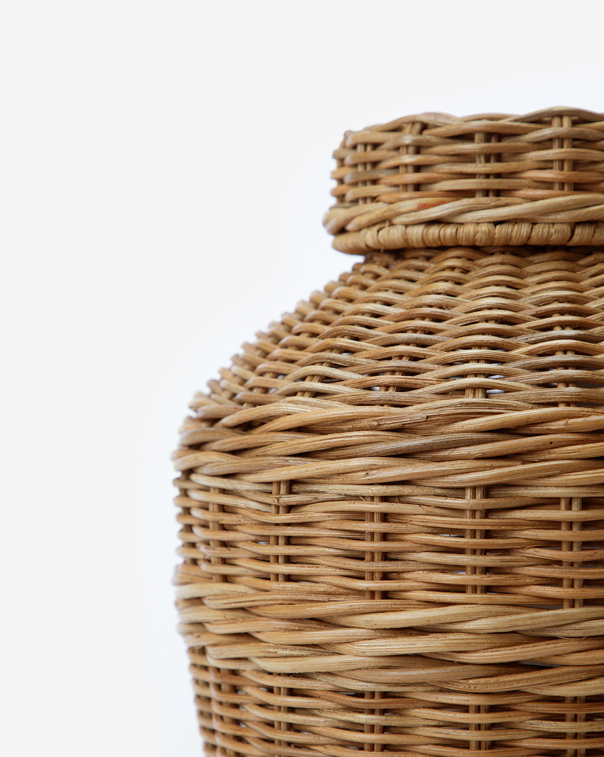 A close-up of the Ahnamia Wicker Jar’s upper half showcases its woven wicker texture and fine craftsmanship against a plain white background.