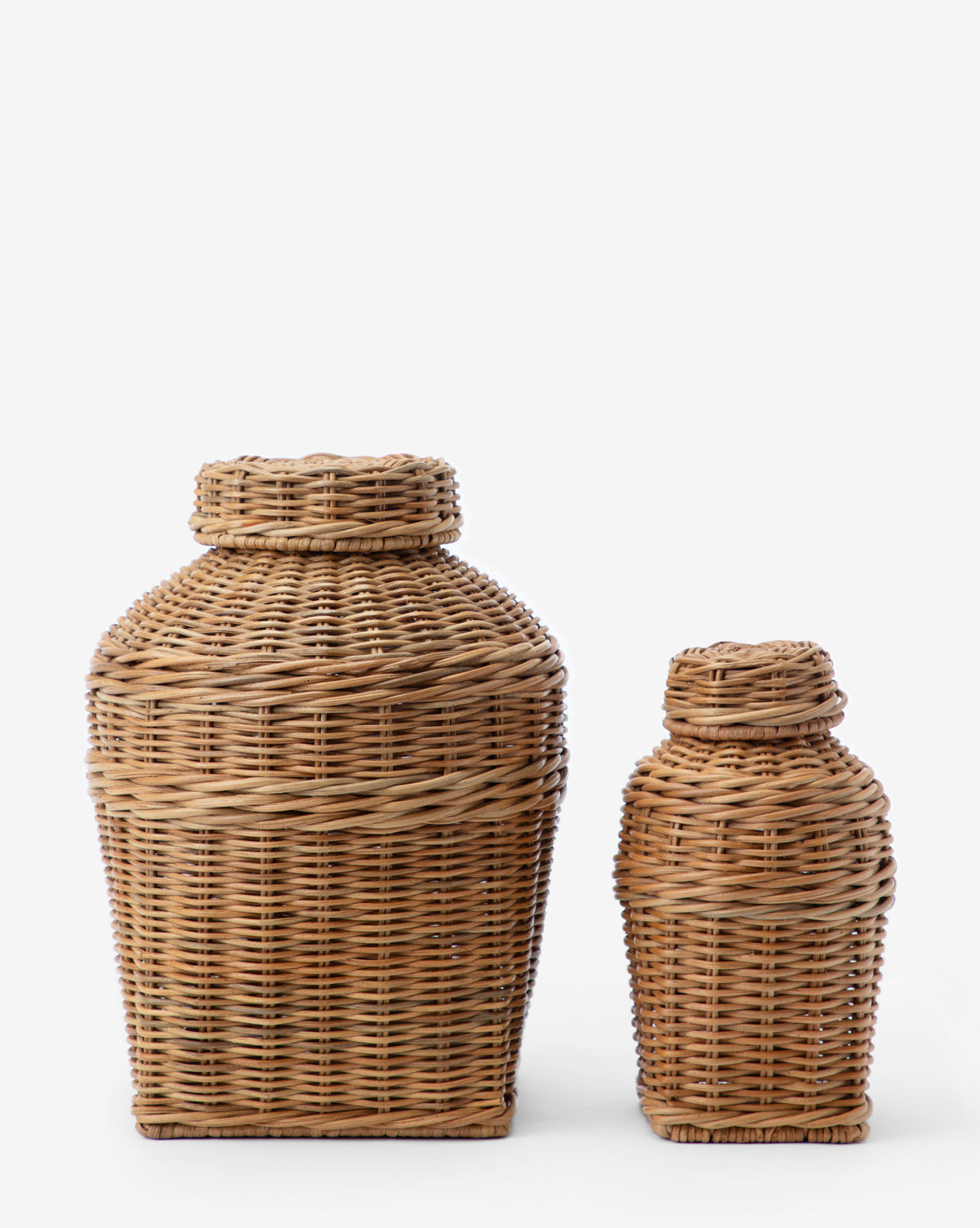 Two Ahnamia Wicker Jars, each with a lidded square base and rounded shoulders, are placed side by side against a plain white background.