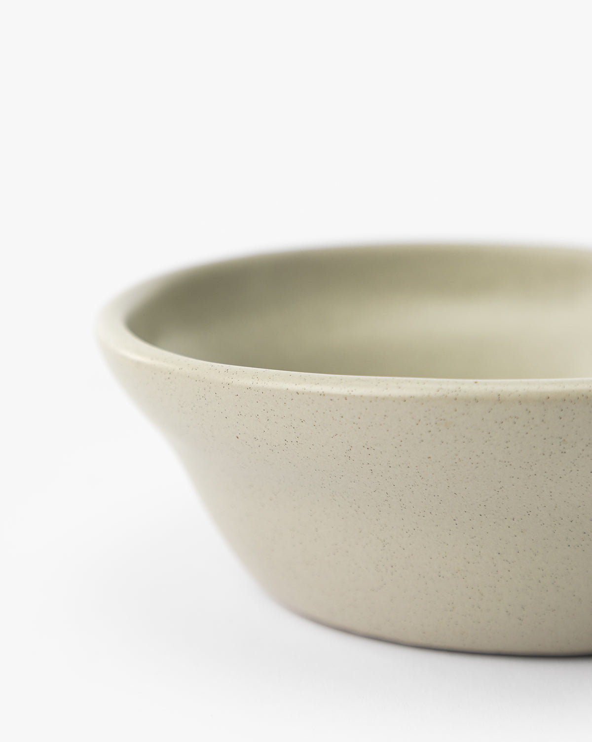 Only part of the rounded edge in soft gray ceramic is visible against a plain white background, by McGee & Co.