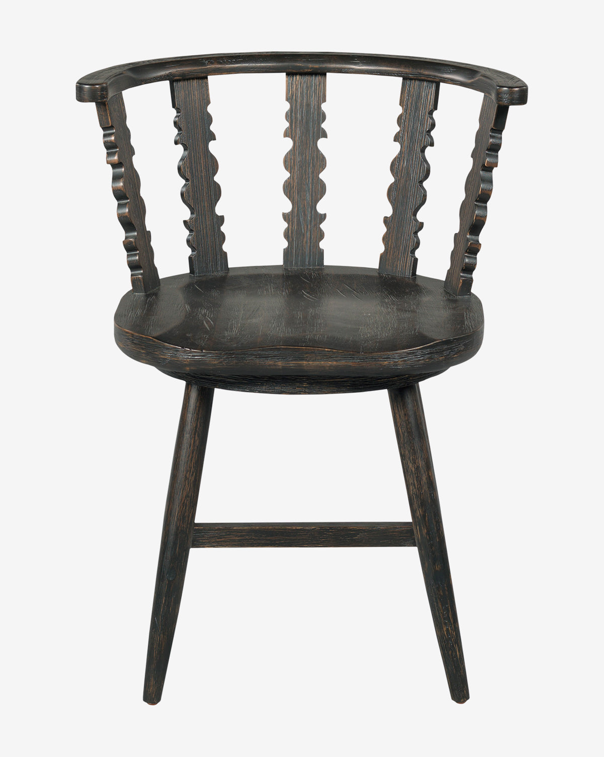 The Woodbridge Alaric Dining Chair has a dark oak frame, curved backrest with three slats, turned side supports, angled legs, and a worn black finish for a charming rustic appeal. McGee & Co.