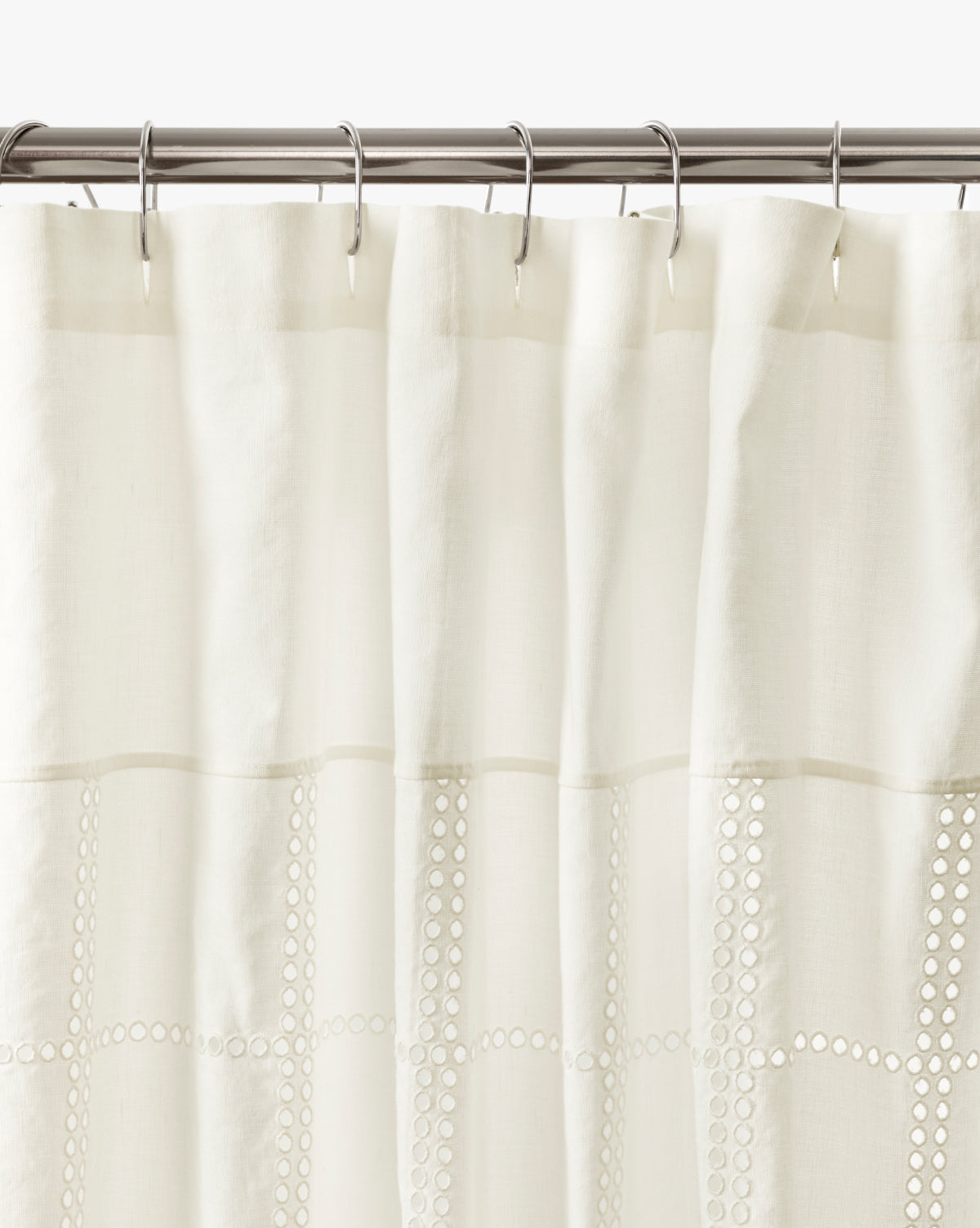 It showcases horizontal decorative cut-out bands, bringing an elegant touch to bathroom decor, by McGee & Co.