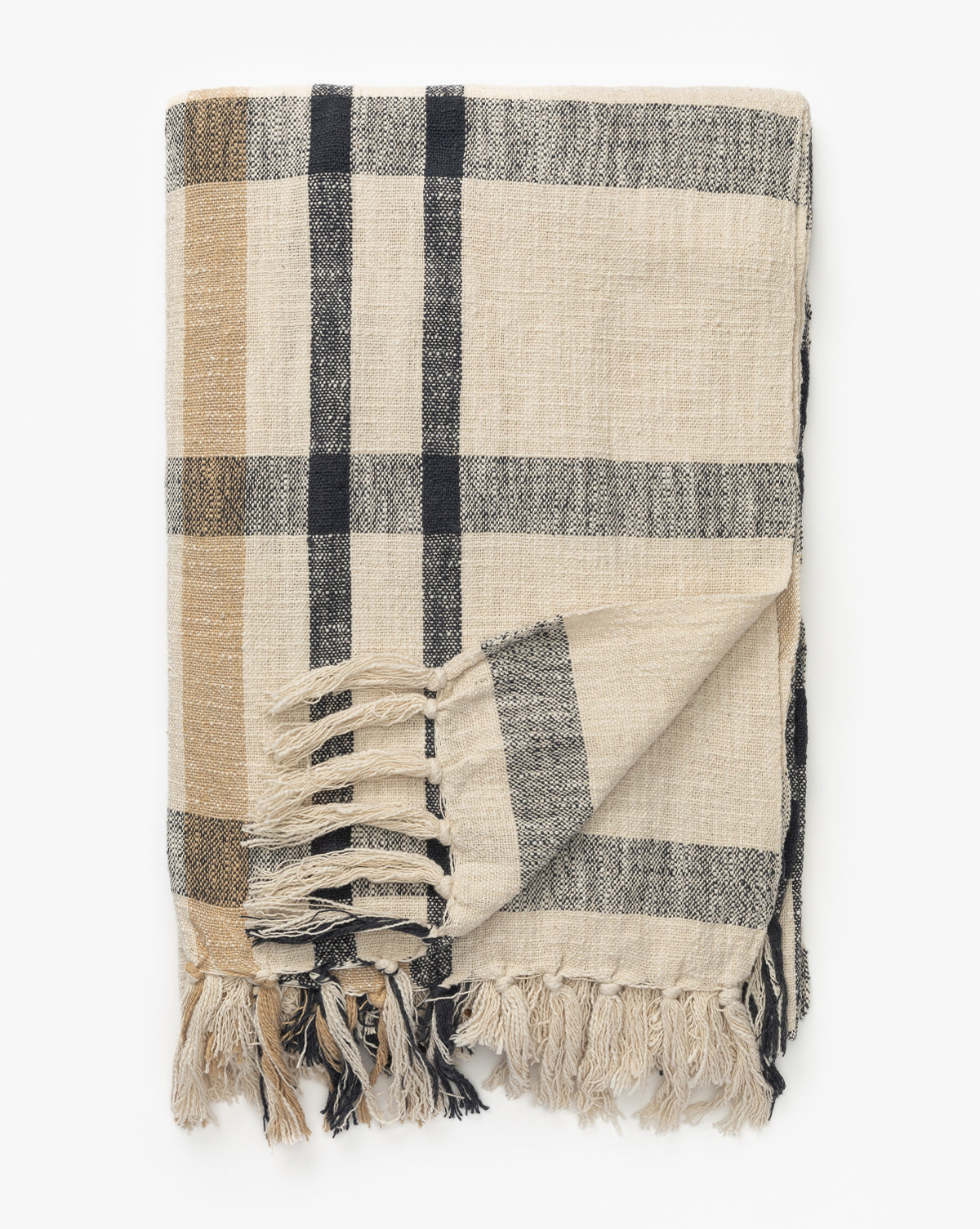 The Raj Albright Plaid Throw features a folded beige design with black and brown stripes and fringe tassels, shown on a white background, McGee & Co.