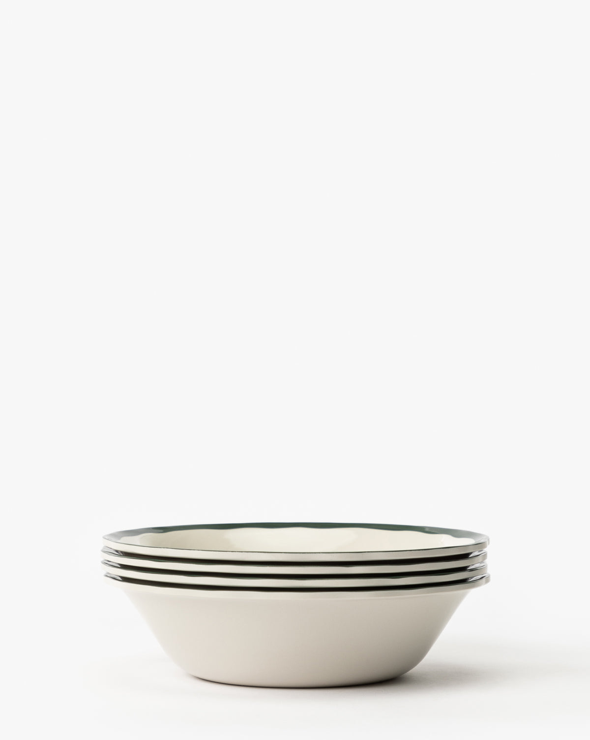 A set of four Alcott Melamine Bowls with thin dark rims is stacked against a plain white background by McGee & Co.