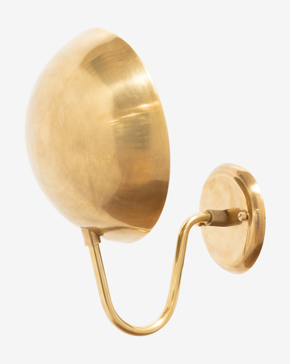 The Aldorno Sconce by Makerspalm features a modern wall-mounted design with a round shade, curved arm, and circular base in polished gold—ideal for bringing elegant lighting to your space. McGee & Co.