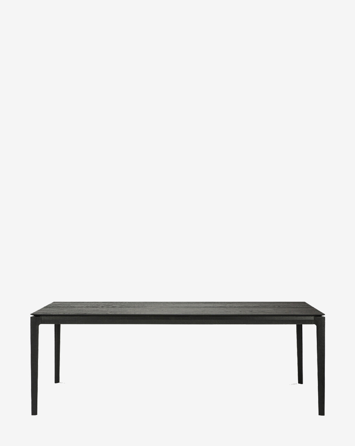 The Alec Dining Table features a minimalist rectangular black design with four slender legs and sturdy construction, shown on a plain white background by McGee & Co.