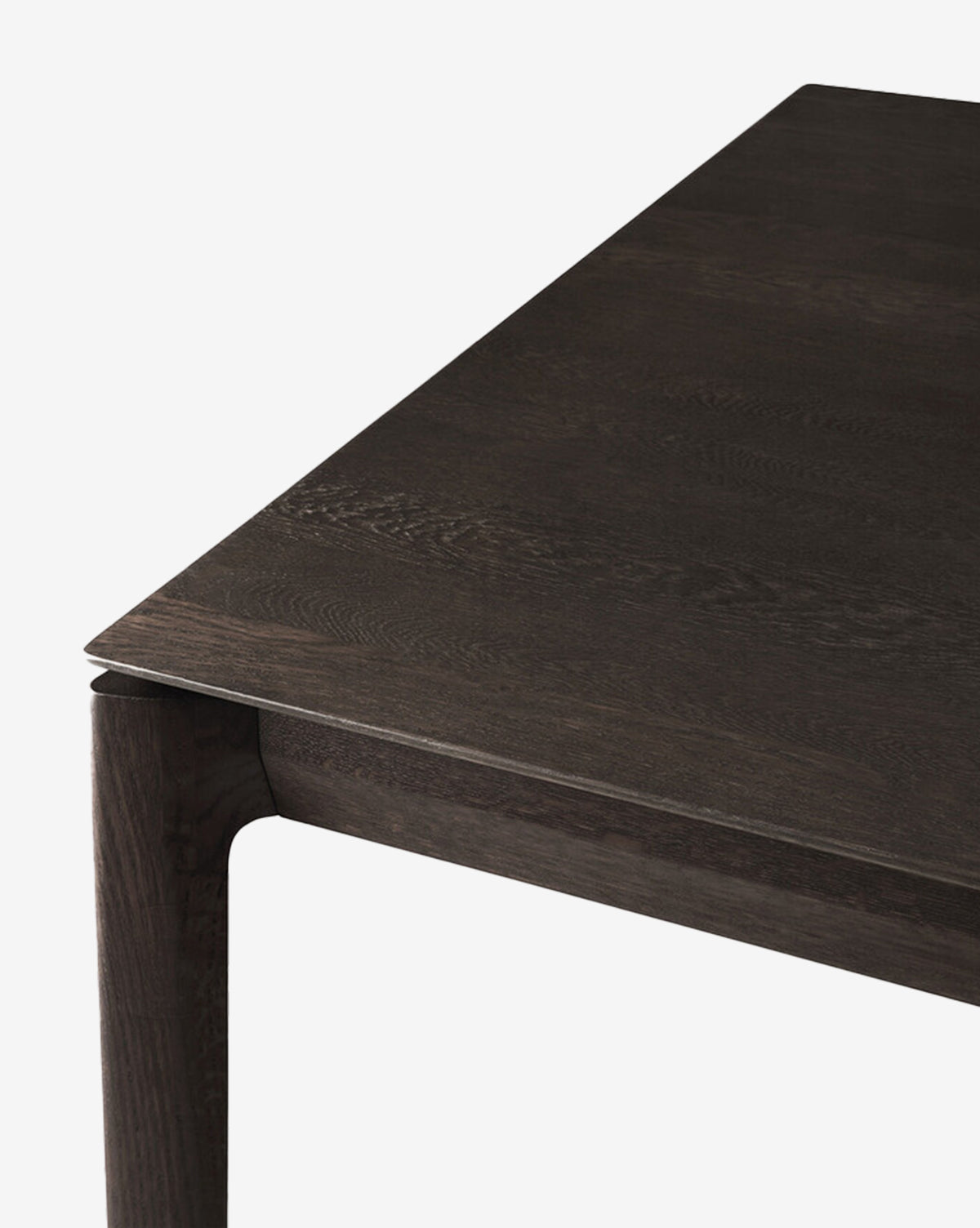 Close-up of the Alec Dining Table corner highlights its sturdy build, smooth flat surface, and subtly rounded legs against a plain white background—an ideal choice for any dining room, by McGee & Co.