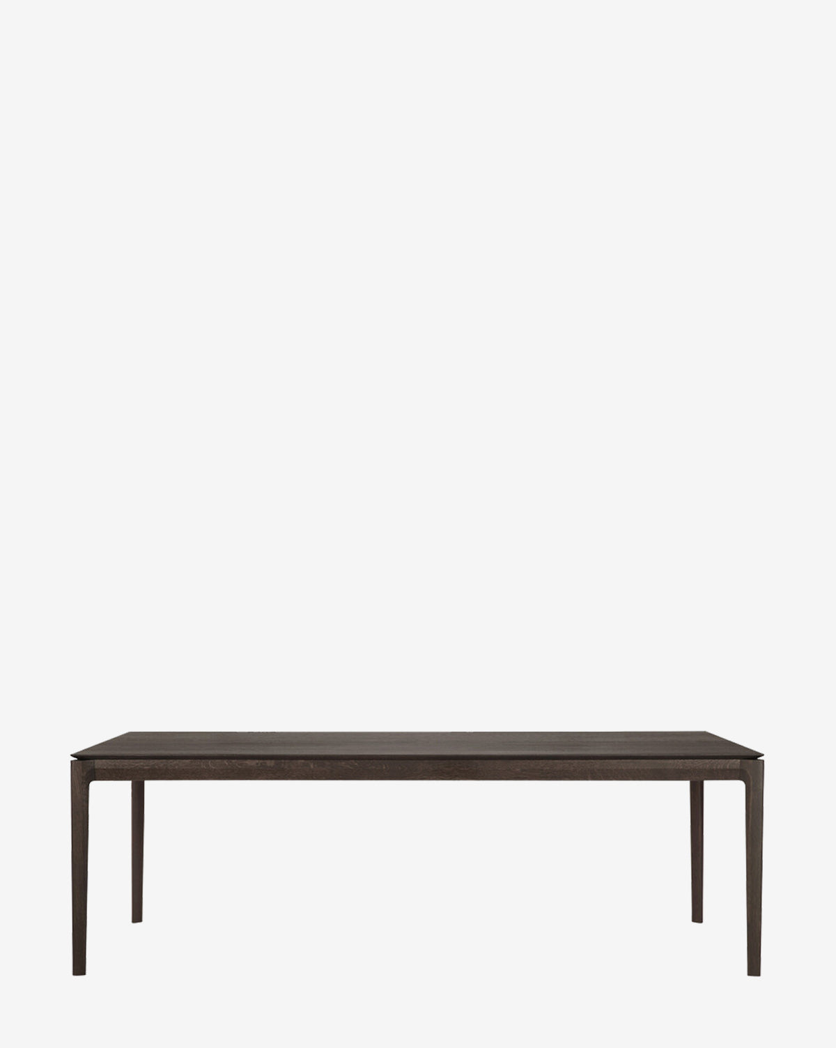 The Alec Dining Table boasts sturdy construction and a minimalist rectangular dark wood design with four slender legs, making it ideal for any modern dining room, by McGee & Co.