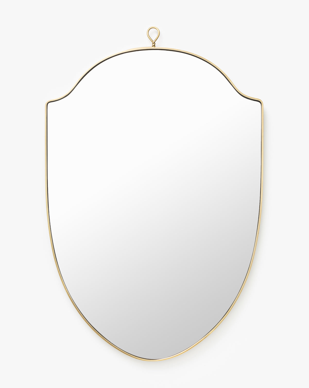 The Allegheny Wall Mirror features a shield shape, thin gold frame, and a small hanging loop at the top, displayed on a plain white background by McGee & Co.