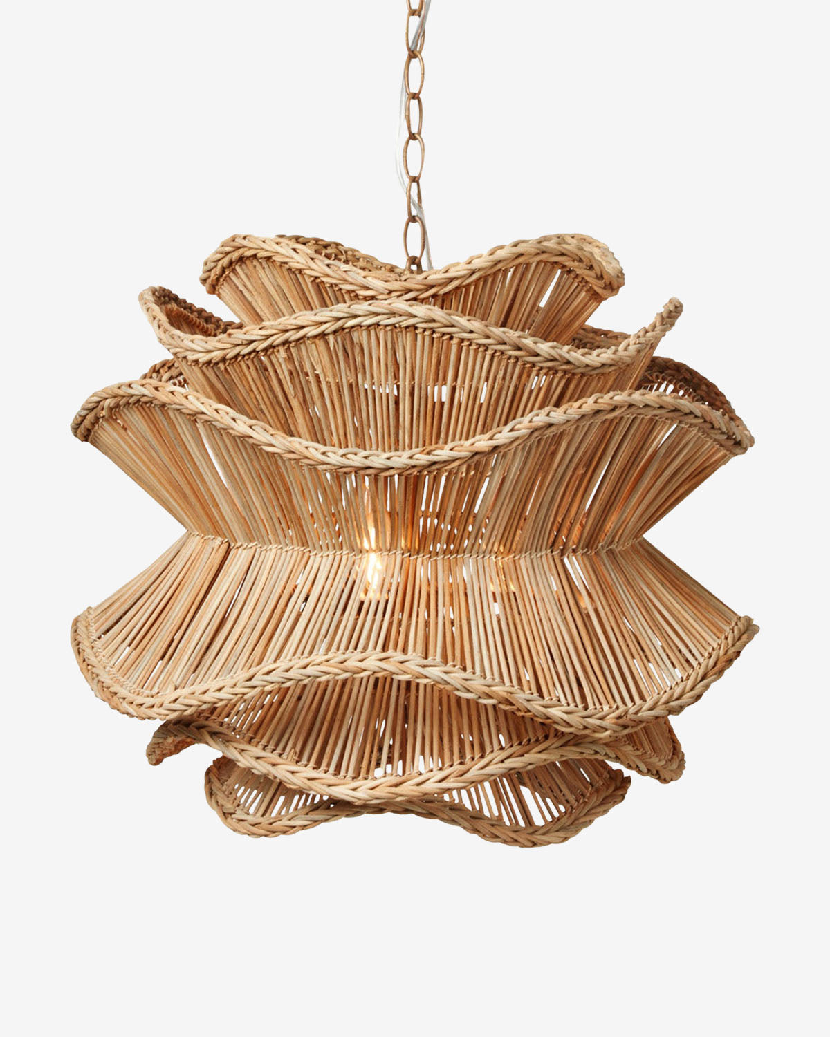 The Alondra Chandelier by Made Goods is a woven rattan pendant with a sculptural, wavy design and visible bulb, offering striking organic lighting by McGee & Co.