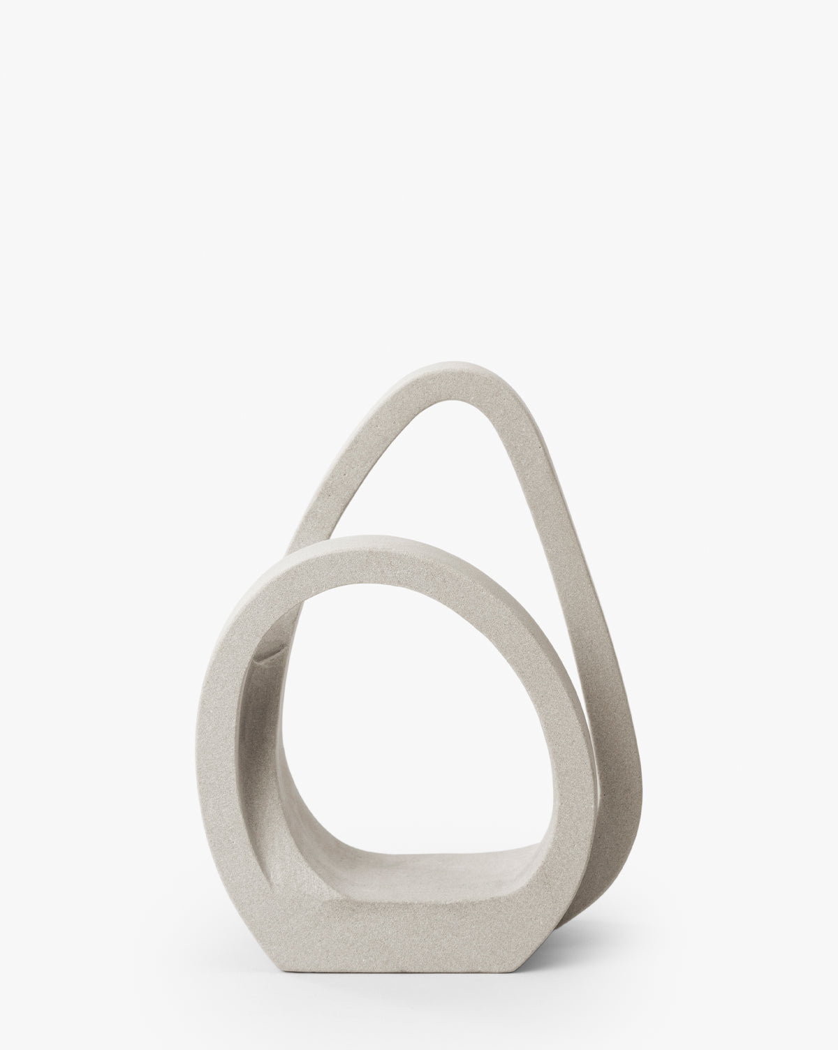 The Alto Stone Object is a sculptural, abstract bench crafted from mint sandstone, featuring smooth, looping shapes and gentle curves. Its modern, minimalist design makes it an ideal statement decor piece against a plain white background, by McGee & Co.