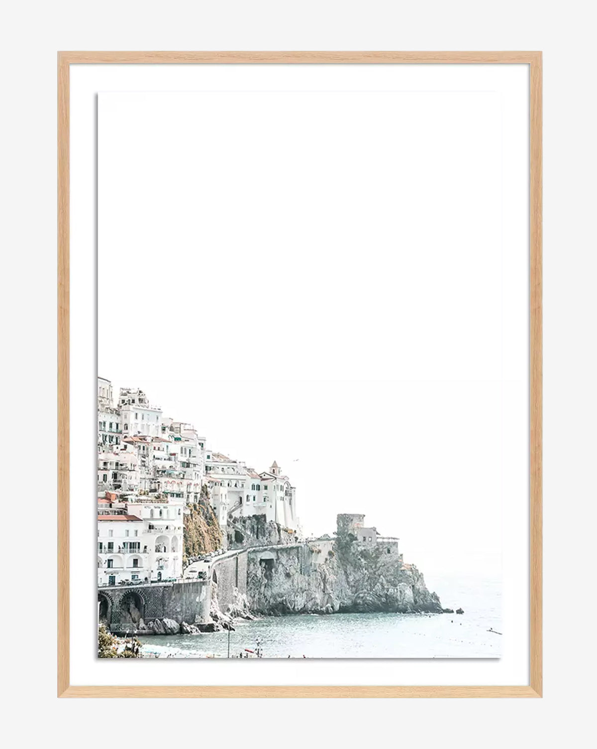Amalfi Overexpose by Natalie Obradovich: a framed art print depicting a coastal town with white buildings on cliffs above the sea, inspired by the Amalfi coast, with a bright minimalist background and pastel tones.