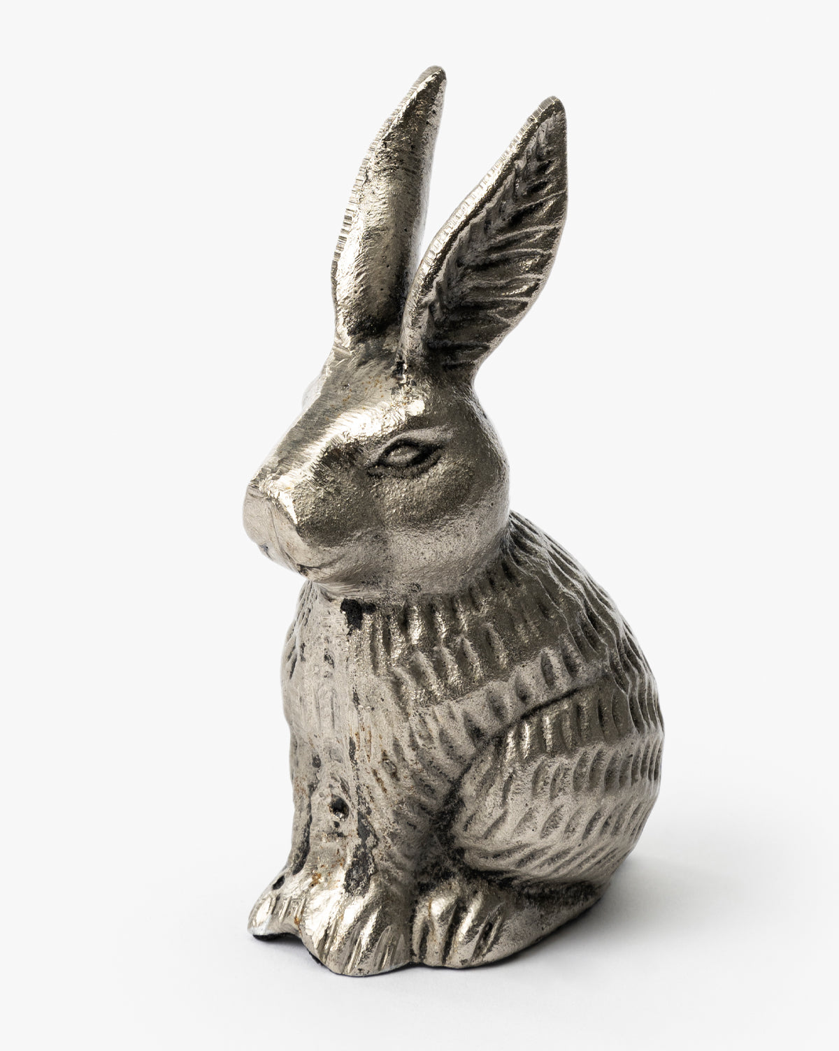 The Antique Pewter Bunny sits upright as a decorative object, displaying an iron finish, detailed fur texture, and long upright ears against a plain white background, by McGee & Co.