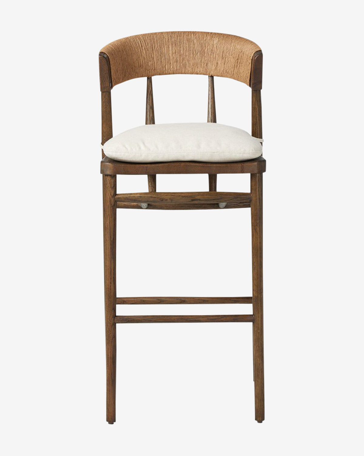 Front view of the Ardent Stool by Four Hands: features an oak frame, light beige cushioned seat, and a curved natural paper rush woven backrest, shown against a plain white background. McGee & Co.
