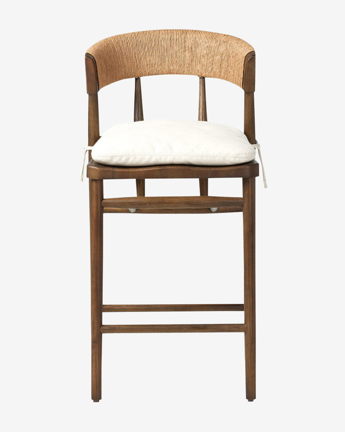 The Ardent Stool by Four Hands boasts a solid oak frame, a curved woven backrest, and a white cushioned seat with ties—ideal for bringing style and comfort to your kitchen bar. McGee & Co.