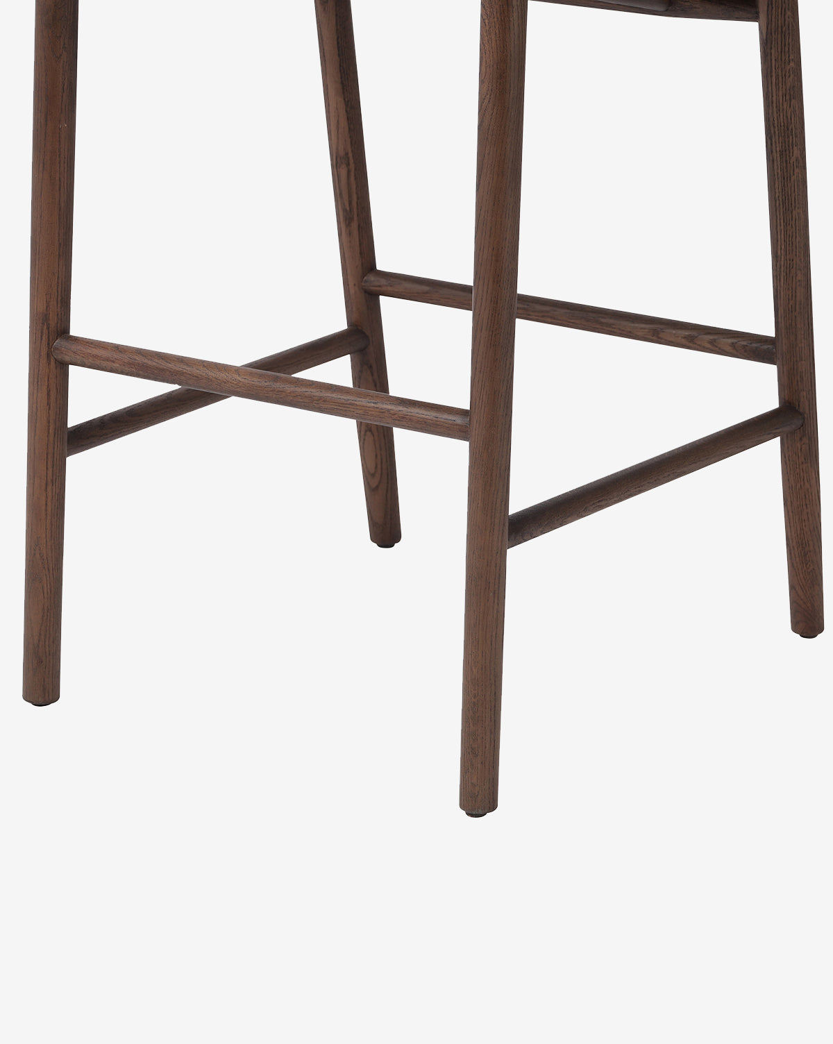 Close-up of the Ardent Stool by Four Hands, highlighting its solid oak frame and footrest—an ideal addition to any kitchen bar, set against a plain white background. McGee & Co.