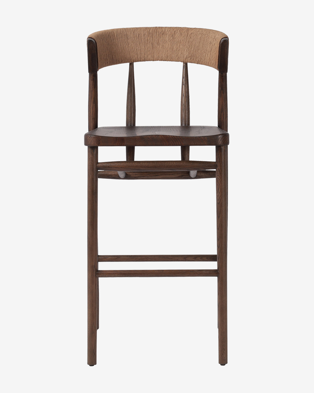 The Ardent Stool by Four Hands features a solid oak frame, dark brown seat and legs, a curved backrest, and light woven detailing—ideal for any modern kitchen bar. McGee & Co.