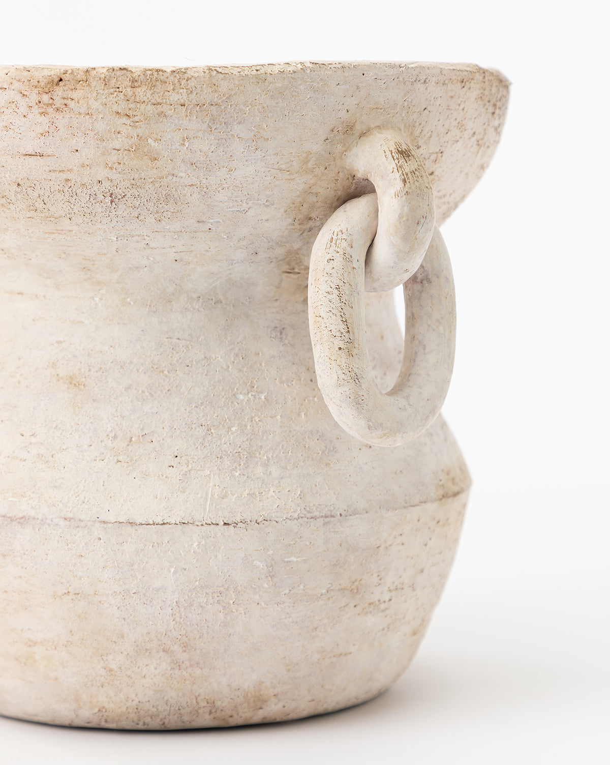 A close-up of the Arnette Terracotta Vase, featuring a textured off-white finish and a thick, round side handle, set against a plain white background.