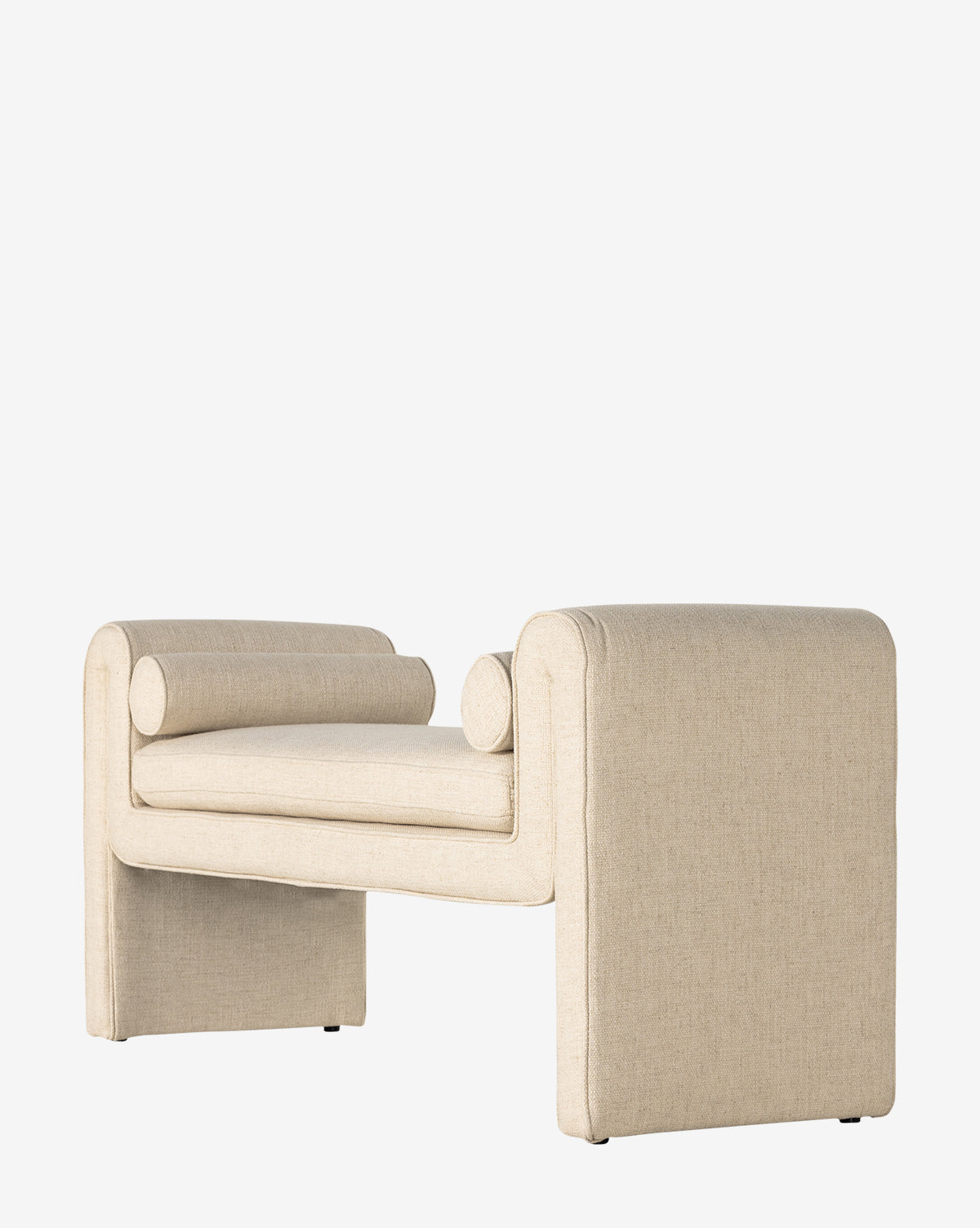 The Ashlyn Bench is a modern piece with beige upholstery, square armrests, and cylindrical bolster pillows at each end, shown on a plain white background by McGee & Co.