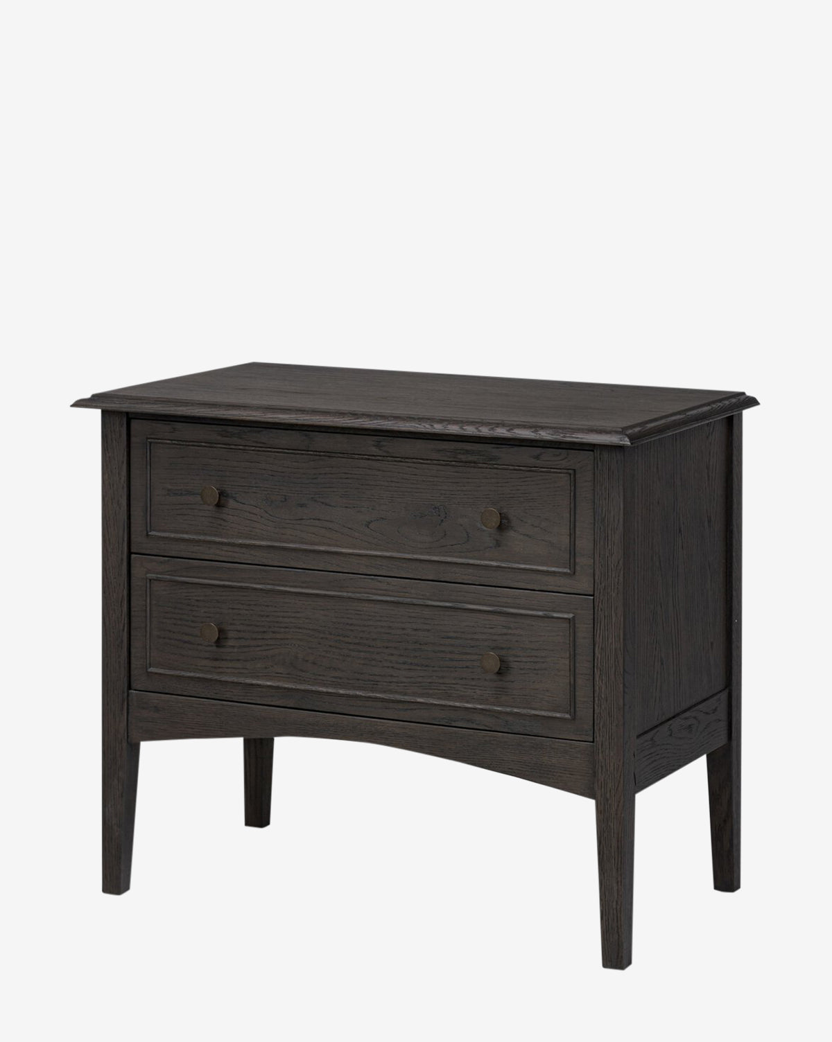 The Aurelian Nightstand is a smoked oak dresser with two drawers and round knobs, standing on four tapered legs for elegant bedroom storage against a plain white background by McGee & Co.