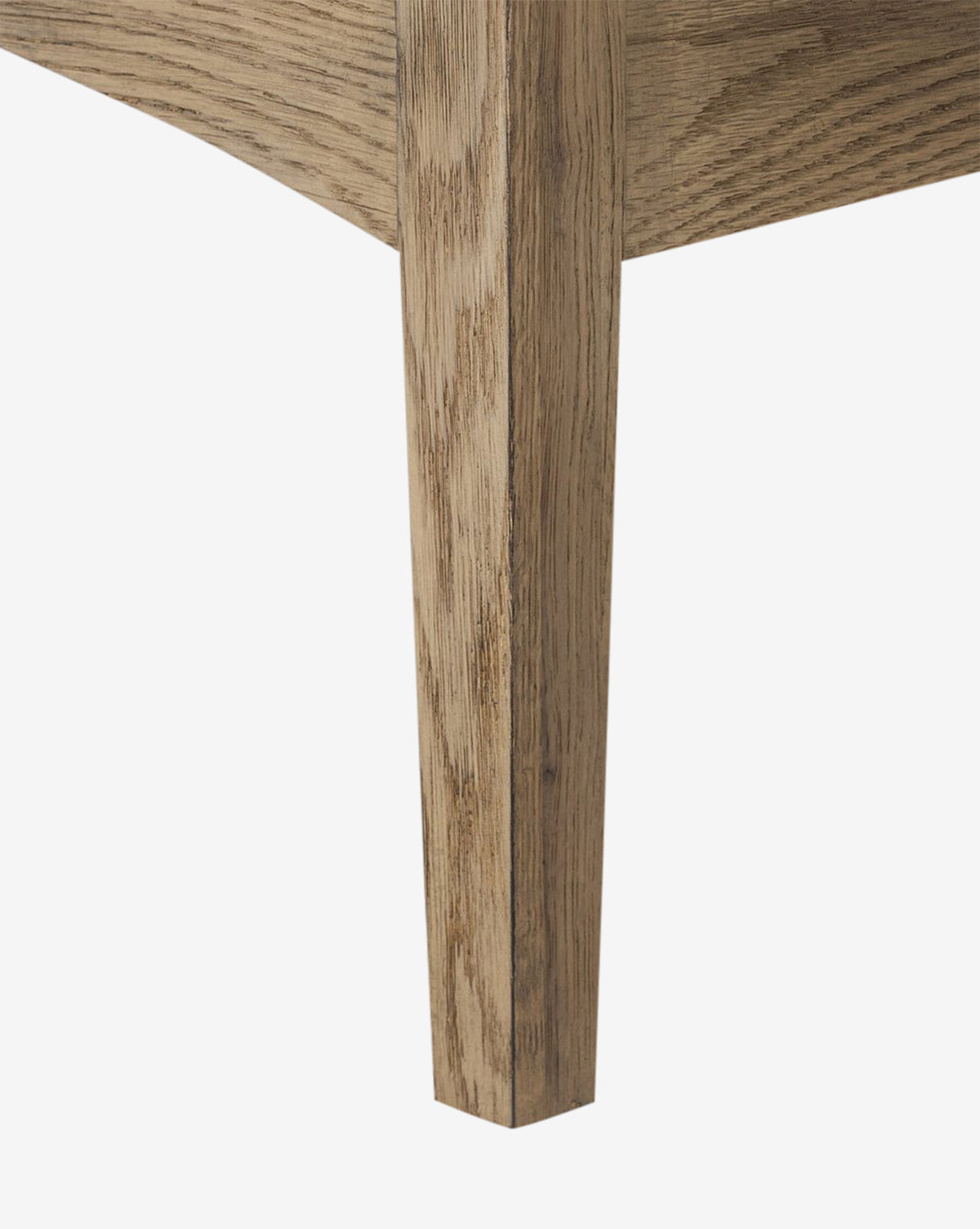 Close-up of the Aurelian Nightstands corner leg and lower frame in smoked oak, showcasing wood grain and texture against a white background—an elegant choice for bedroom storage, by McGee & Co.