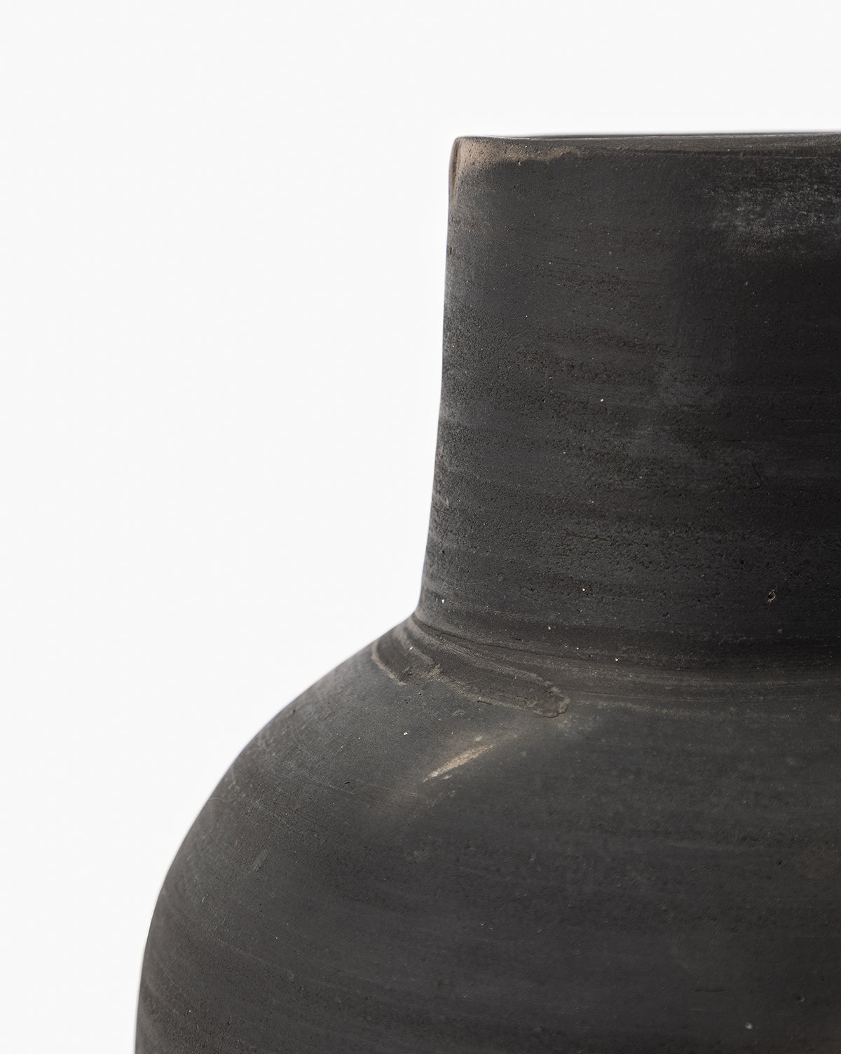 Close-up of the upper portion of the Auster Distressed Vase, featuring a smooth dark gray ceramic finish, cylindrical neck, and rounded shoulder, set against a plain white background, by McGee & Co.
