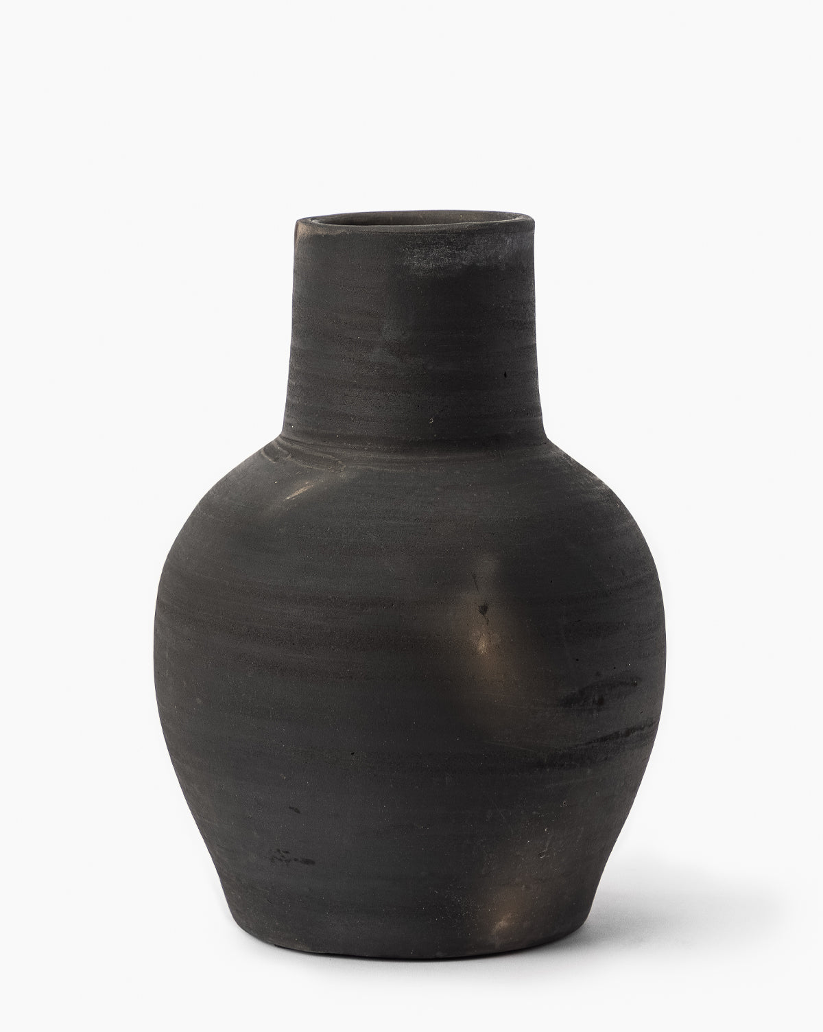 The Auster Distressed Vase is a matte black, vintage-inspired ceramic piece featuring a wide body and narrow cylindrical neck, shown against a plain white background, by McGee & Co.