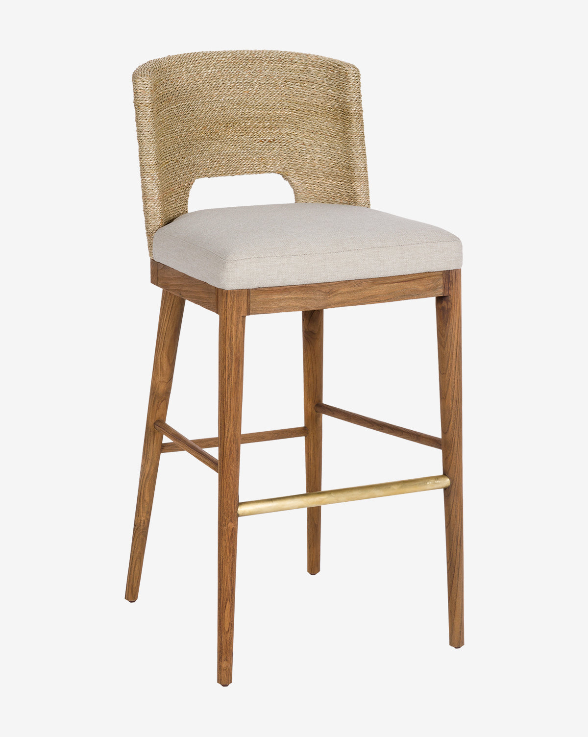 The Ava Seagrass Counter Stool features a teak frame, hand-woven seagrass curved backrest, beige upholstered seat, and brass footrest, displayed against a plain white background.