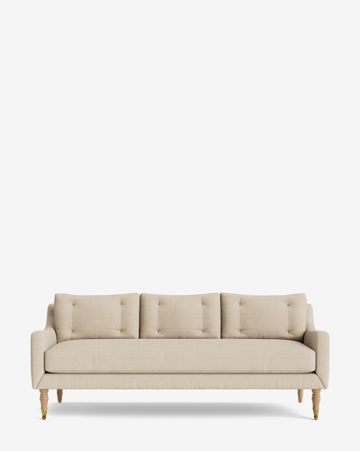 The Barden Sofa 84 is a beige three-seater with reeded wood legs and three back cushions, shown against a plain white background by McGee & Co.