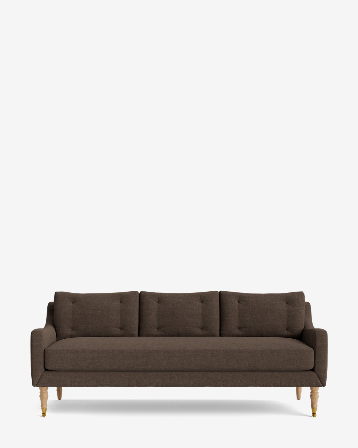 The Barden Sofa 84 is a modern sofa in dark brown with three seat and back cushions, reeded wood legs, and a minimalist design, shown against a plain white background by McGee & Co.