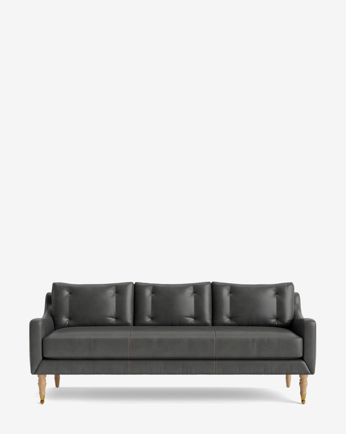 The Barden Sofa 84 is a modern dark gray sofa with three seat and back cushions, elegant reeded wood legs, shown against a plain white background by McGee & Co.