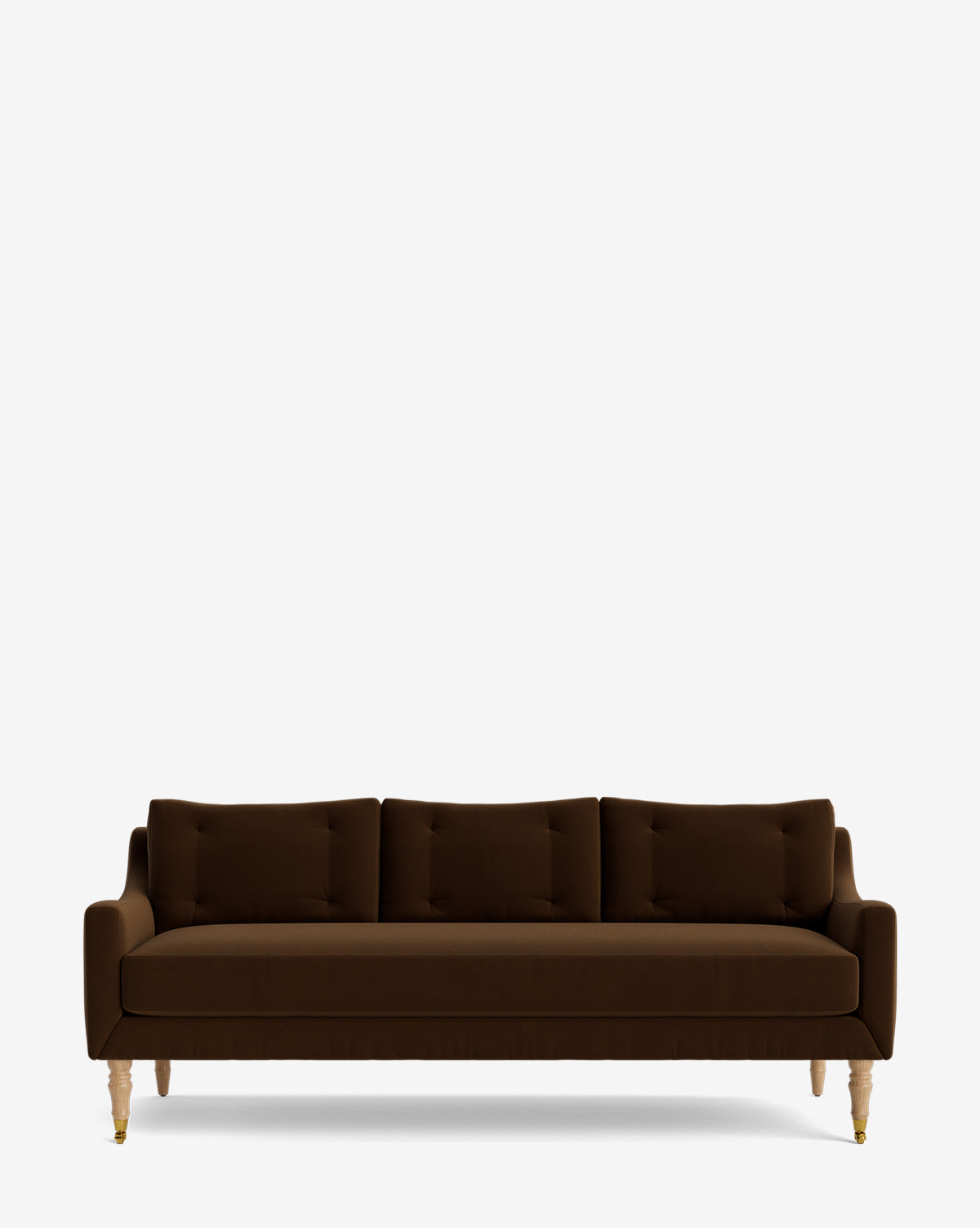 The Barden Sofa 84 is a modern dark brown sofa with tufted three seat and back cushions and light reeded wood legs, shown against a plain white background by McGee & Co.