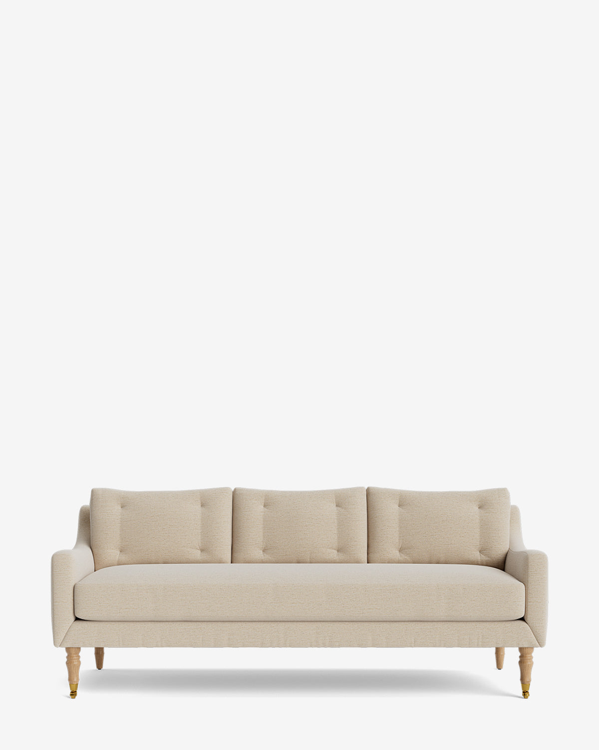 The Barden Sofa 84 is a beige three-seater with tufted cushions, slim armrests, and elegant reeded wood legs, shown against a plain white background by McGee & Co.