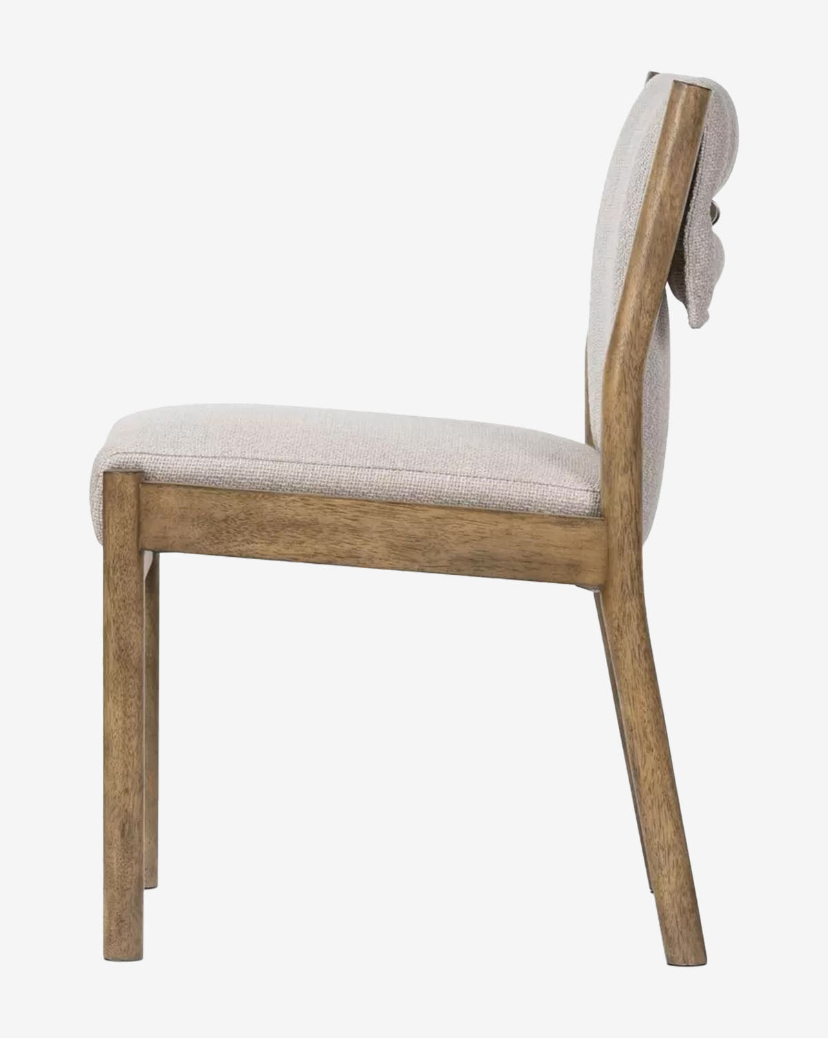 Side view of the Bardot Dining Chair featuring a cushioned seat and backrest in high-performance fabric, an armless design with clean lines, and a durable parawood frame, by McGee & Co.