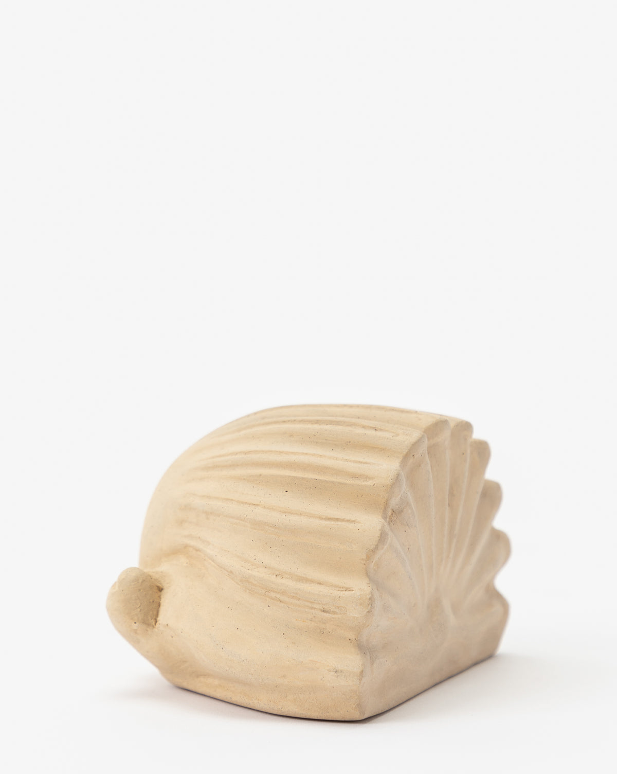 The Baroque Shell Object is a small, beige decorative piece crafted from composite stone with textured ridges, shown on a plain white background.