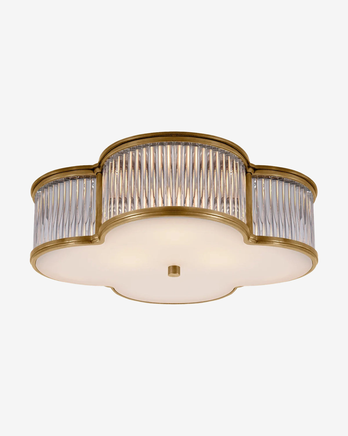 The Basil Flush Mount by Visual Comfort & Co. Signature features a decorative quatrefoil brass frame, vertical glass rods along the sides, and a white frosted glass diffuser on the bottom—McGee & Co.