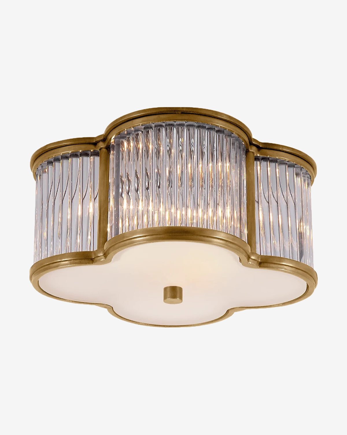 The Basil Flush Mount by Visual Comfort & Co. Signature features a gold and glass quatrefoil design with vertical glass rods on the sides and a frosted glass diffuser at the bottom. McGee & Co.