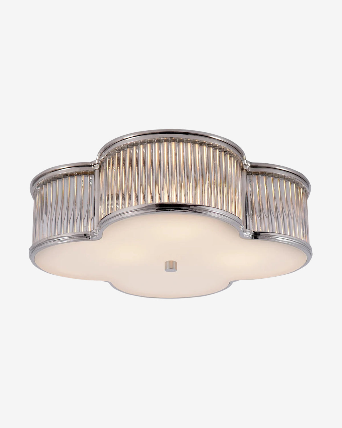 The Basil Flush Mount by Visual Comfort & Co. Signature features a modern clover-shaped metal frame with scalloped edges, vertical ribbed detailing, and a frosted glass diffuser on the bottom by McGee & Co.