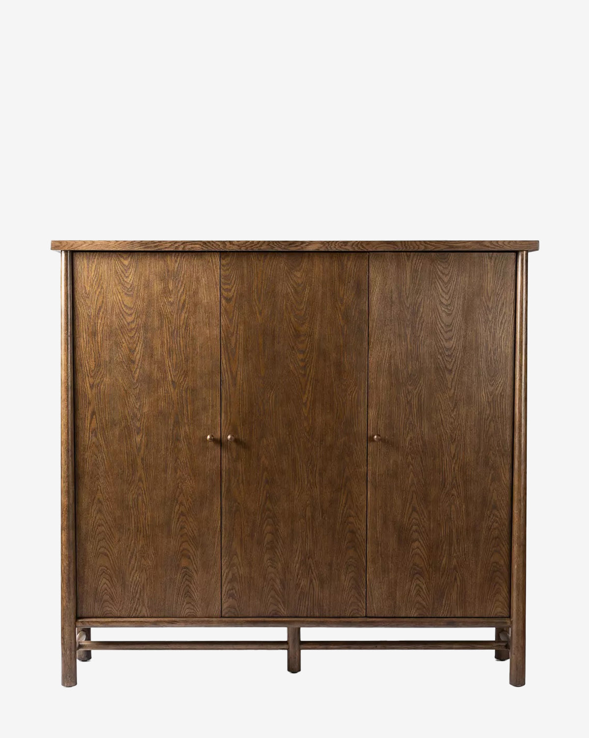 The Beasley 3-Door Cabinet features simple round handles and a minimalist design, finished in dark toasted oak veneer with natural wood grain—an elegant nod to traditional style, by McGee & Co.
